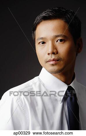 Young executive, looking at camera, portrait View Large Photo Image Stock Photo - Young executive, looking at camera, portrait. Fotosearch