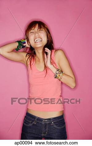 Young woman laughing, portrait View Large Photo Image Picture - Young woman laughing, portrait. Fotosearch