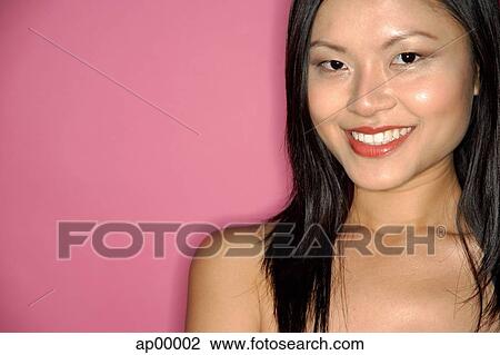 Young woman looking at camera, portrait View Large Photo Image Stock Image - Young woman looking at camera, portrait. Fotosearch