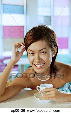 Young woman looking at camera, portrait View Large Photo Image Stock Photograph - Young woman looking at camera, portrait. Fotosearch