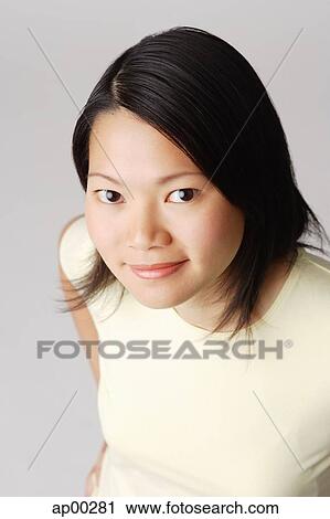 Young woman looking at camera View Large Photo Image Stock Image - Young woman looking at camera. Fotosearch