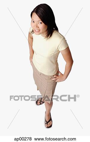 Stock Photo - Young woman looking at camera. Fotosearch