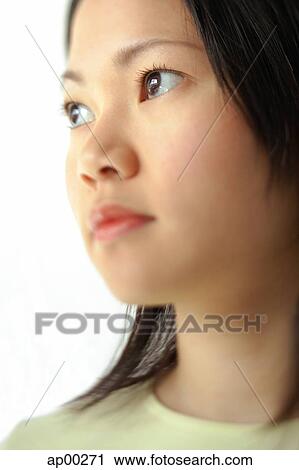 Young woman, looking away, head shot View Large Photo Image Stock Image - Young woman, looking away, head shot. Fotosearch