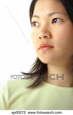 Young woman, looking away, head shot, portrait View Large Photo Image Stock Image - Young woman, looking away, head shot, portrait. Fotosearch
