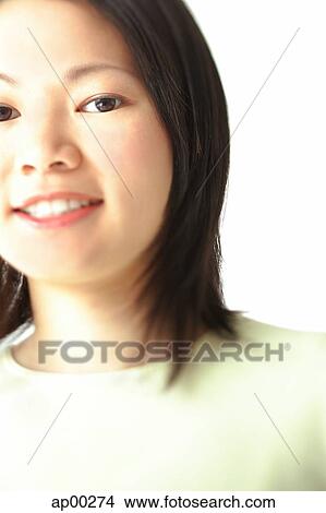Young woman, smiling at camera, head shot, portrait View Large Photo Image Picture - Young woman, smiling at camera, head shot, portrait. Fotosearch