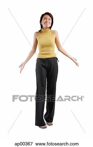 Young woman standing, hands at her side, palms up View Large Photo Image Stock Photo - Young woman standing, hands at her side, palms up. Fotosearch