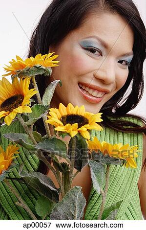 Young woman, with bouquet of flowers, portrait View Large Photo Image Stock Photo - Young woman, with bouquet of flowers, portrait. Fotosearch