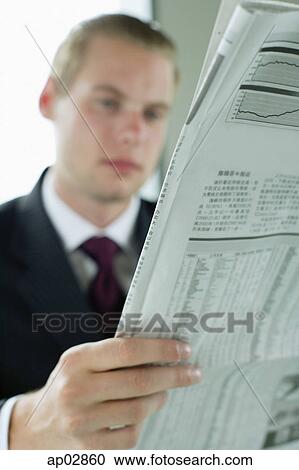 Businessman reading newspaper View Large Photo Image Stock Image - Businessman reading newspaper . Fotosearch