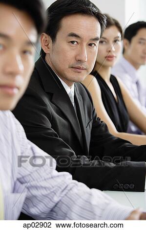 Businessman with executives, in a row View Large Photo Image Stock Image - Businessman with executives, in a row . Fotosearch
