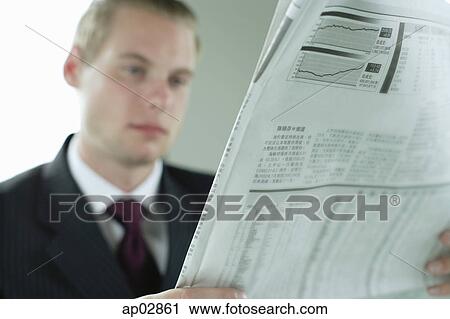Stock Image - Businessman with newspaper . Fotosearch