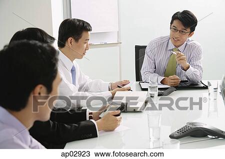 Businessmen in a meeting View Large Photo Image Stock Image - Businessmen in a meeting . Fotosearch