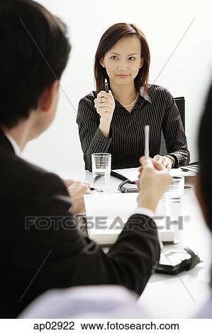 Businesswoman and businessman having a discussion in a meeting View Large Photo Image Stock Image - Businesswoman and businessman having a discussion in a meeting. Fotosearch
