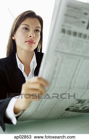 Businesswoman with newspaper View Large Photo Image Stock Image - Businesswoman with newspaper . Fotosearch