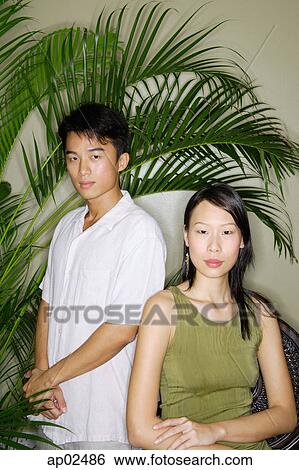 Stock Photograph - Couple looking at camera . Fotosearch