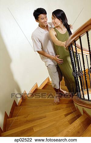 Couple on staircase View Large Photo Image Stock Image - Couple on staircase . Fotosearch