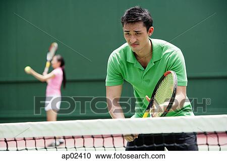 Couple playing tennis View Large Photo Image Stock Image - Couple playing tennis . Fotosearch