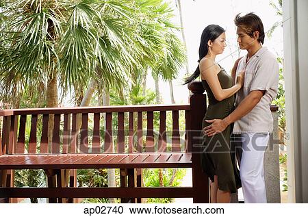 Couple standing face to face, embracing View Large Photo Image Stock Image - Couple standing face to face, embracing . Fotosearch