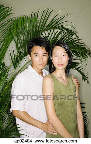 Couple standing side by side, portrait View Large Photo Image Picture - Couple standing side by side, portrait . Fotosearch
