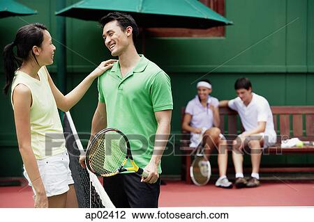 Couples at tennis court View Large Photo Image Stock Image - Couples at tennis court . Fotosearch