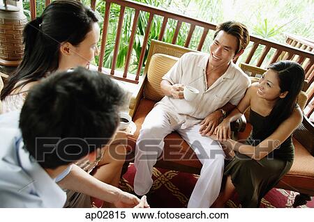 Couples sitting together, having coffee View Large Photo Image Stock Photography - Couples sitting together, having coffee . Fotosearch