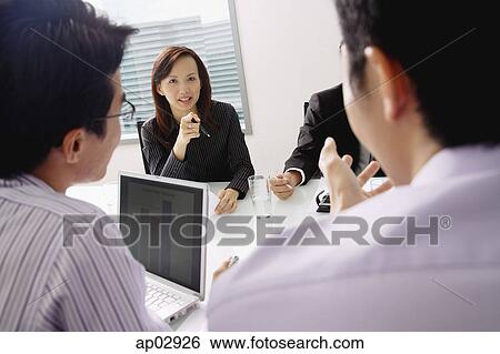 Executives having a meeting View Large Photo Image Stock Photograph - Executives having a meeting . Fotosearch