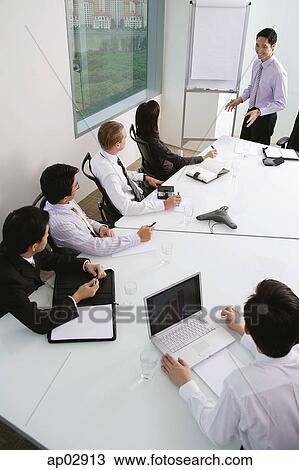 Executives in a meeting View Large Photo Image Stock Image - Executives in a meeting . Fotosearch
