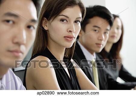 Executives in a row, looking at camera, head shot View Large Photo Image Stock Image - Executives in a row, looking at camera, head shot . Fotosearch