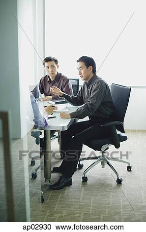 Executives in meeting room View Large Photo Image Stock Image - Executives in meeting room . Fotosearch