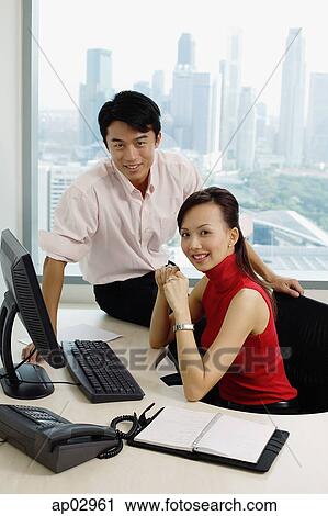 Executives in office looking camera View Large Photo Image Stock Image - Executives in office looking camera. Fotosearch