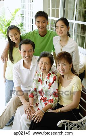 Family looking up at camera, portrait View Large Photo Image Stock Photo - Family looking up at camera, portrait . Fotosearch