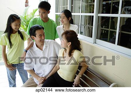 Family spending time together at patio View Large Photo Image Picture - Family spending time together at patio . Fotosearch