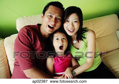 Family with one child, smiling at camera View Large Photo Image Stock Photo - Family with one child, smiling at camera. Fotosearch