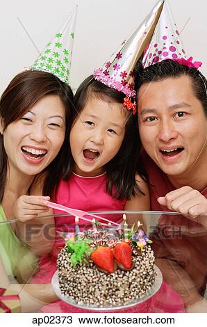 Family with one daughter celebrating a birthday View Large Photo Image Stock Image - Family with one daughter celebrating a birthday . Fotosearch