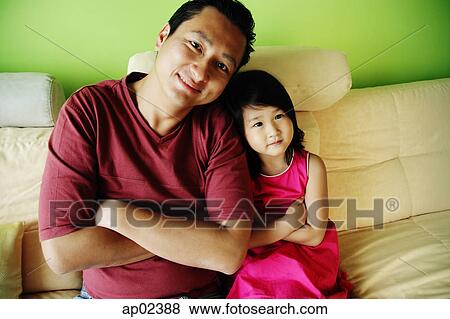 Father with one child, arms crossed View Large Photo Image Stock Photo - Father with one child, arms crossed. Fotosearch