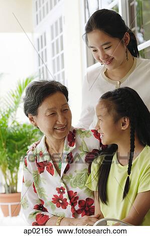 Grandmother with two granddaughters View Large Photo Image Stock Photography - Grandmother with two granddaughters . Fotosearch
