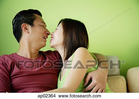 Picture - Husband and wife, face to face, embracing . Fotosearch