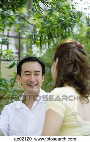 Husband looking at wife, smiling View Large Photo Image Stock Image - Husband looking at wife, smiling . Fotosearch