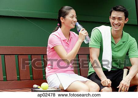 Man and Woman sitting on bench View Large Photo Image Stock Photo - Man and Woman sitting on bench . Fotosearch