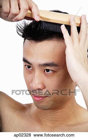 Man brushing hair View Large Photo Image Stock Photo - Man brushing hair . Fotosearch