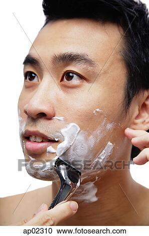 Man shaving face View Large Photo Image Stock Image - Man shaving face . Fotosearch