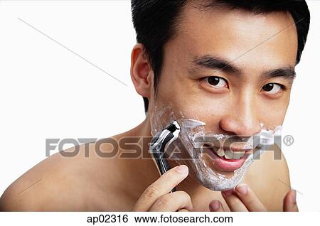 Man shaving, smiling at camera View Large Photo Image Stock Photograph - Man shaving, smiling at camera . Fotosearch