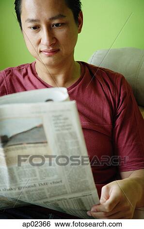 Man sitting, reading newspaper View Large Photo Image Stock Photograph - Man sitting, reading newspaper. Fotosearch