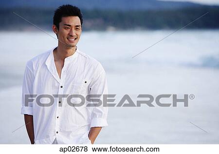 Man standing, smiling, portrait View Large Photo Image Stock Photo - Man standing, smiling, portrait. Fotosearch