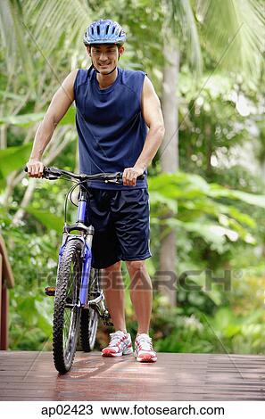 Man with bicycle View Large Photo Image Stock Image - Man with bicycle . Fotosearch