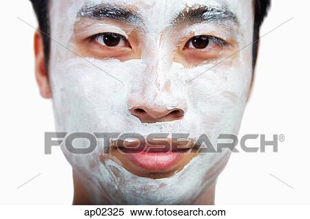 Man with face mask looking at camera View Large Photo Image Stock Photography - Man with face mask looking at camera . Fotosearch