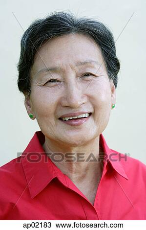 Mature woman smiling at camera View Large Photo Image Stock Image - Mature woman smiling at camera . Fotosearch