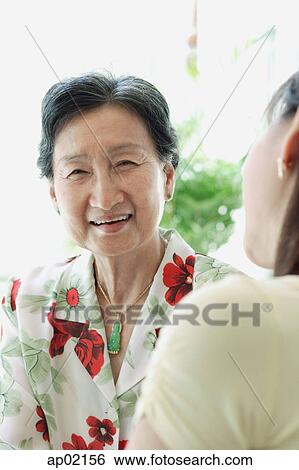 Mature woman smiling View Large Photo Image Stock Photograph - Mature woman smiling . Fotosearch
