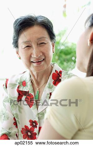 Mother with adult daughter, over the shoulder view View Large Photo Image Stock Photography - Mother with adult daughter, over the shoulder view . Fotosearch