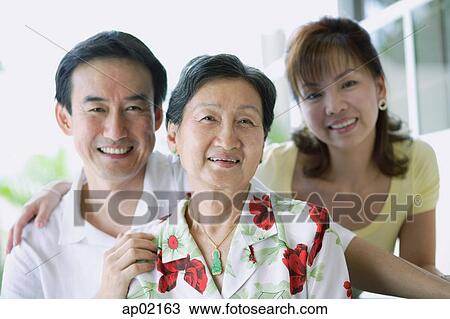 Stock Image - Portrait of a family, smiling . Fotosearch