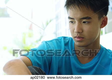 Teenaged boy looking away View Large Photo Image Stock Image - Teenaged boy looking away. Fotosearch